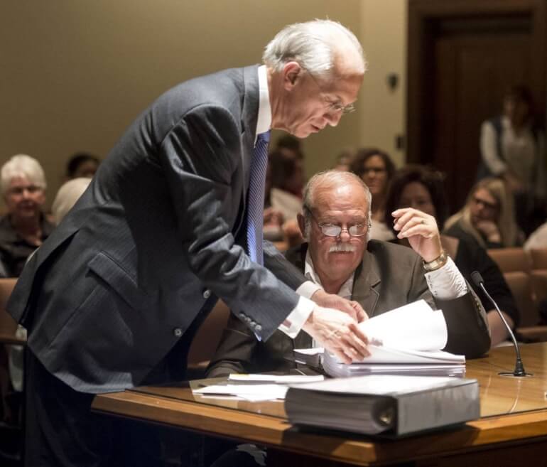 Attorney David Domina sorts through his files at the Whiteclay hearing. Photo by Kristin Streff, Journal Star.